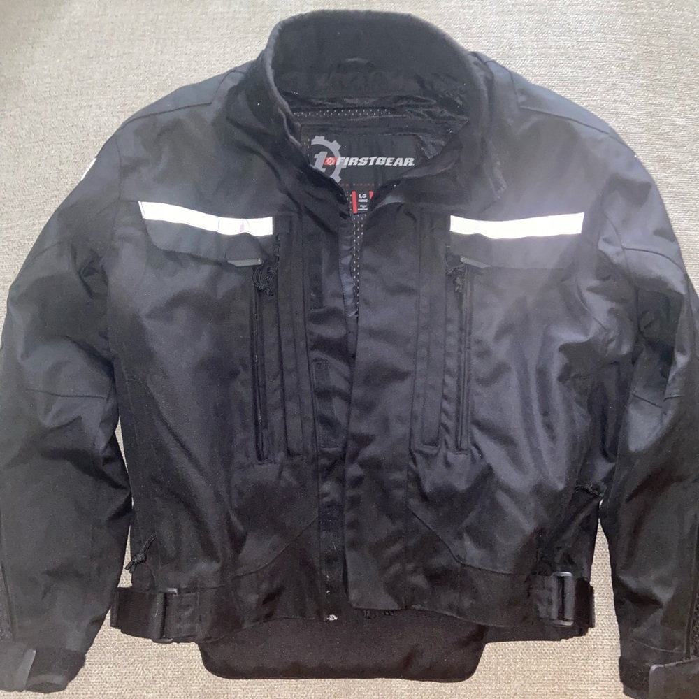 Firstgear motorcycle jacket size LG w/inserts and armor.
